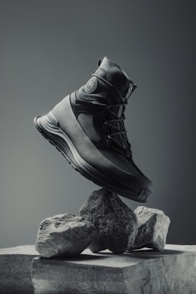 A pair of shoes sitting on top of a rock