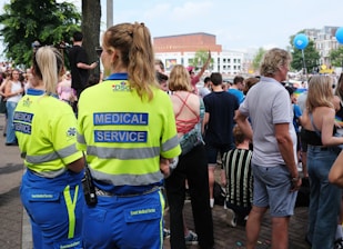 A group of people standing around each other