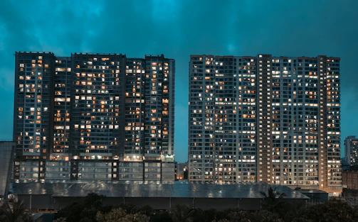 A couple of tall buildings sitting next to each other