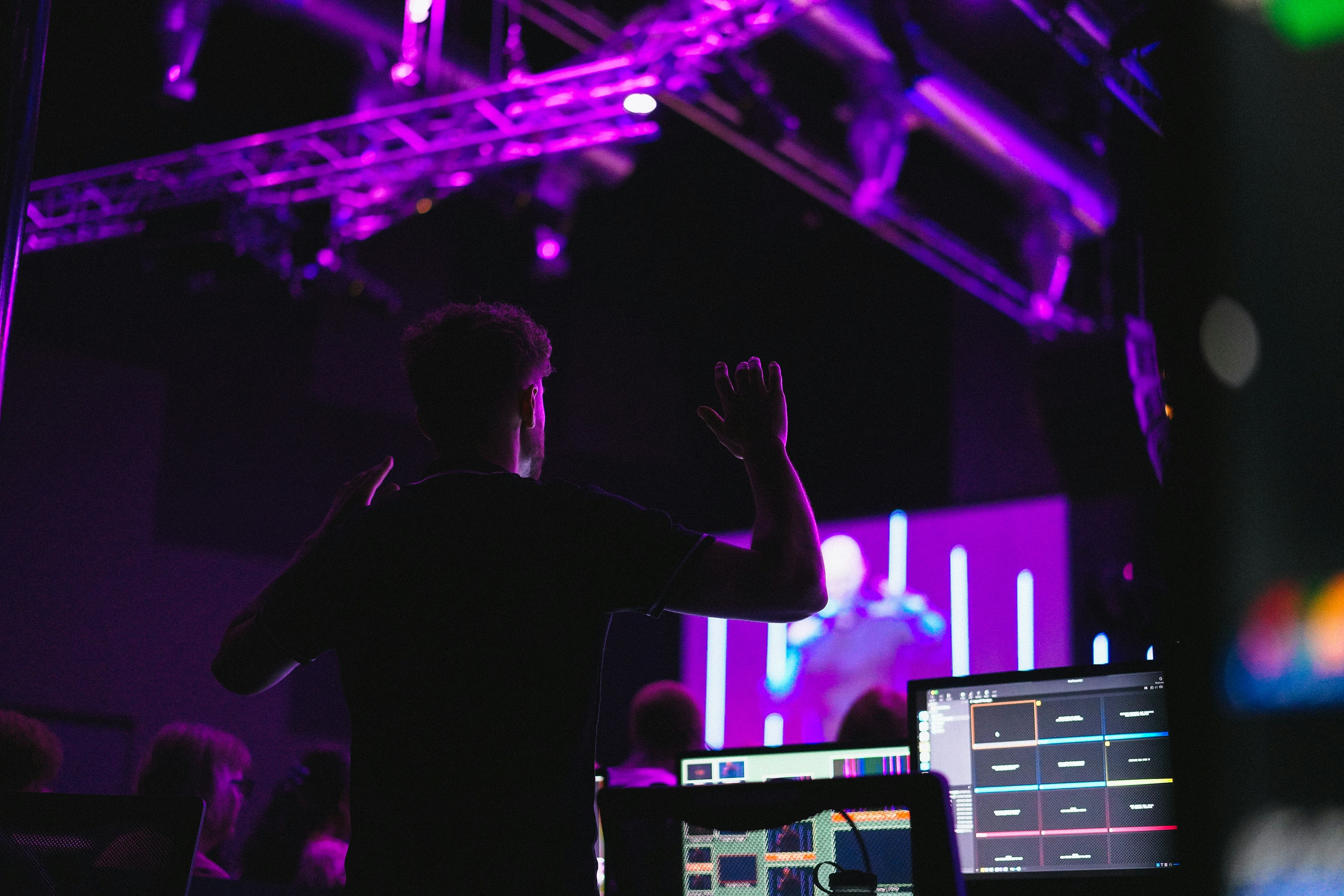 A man standing in front of a laptop computer