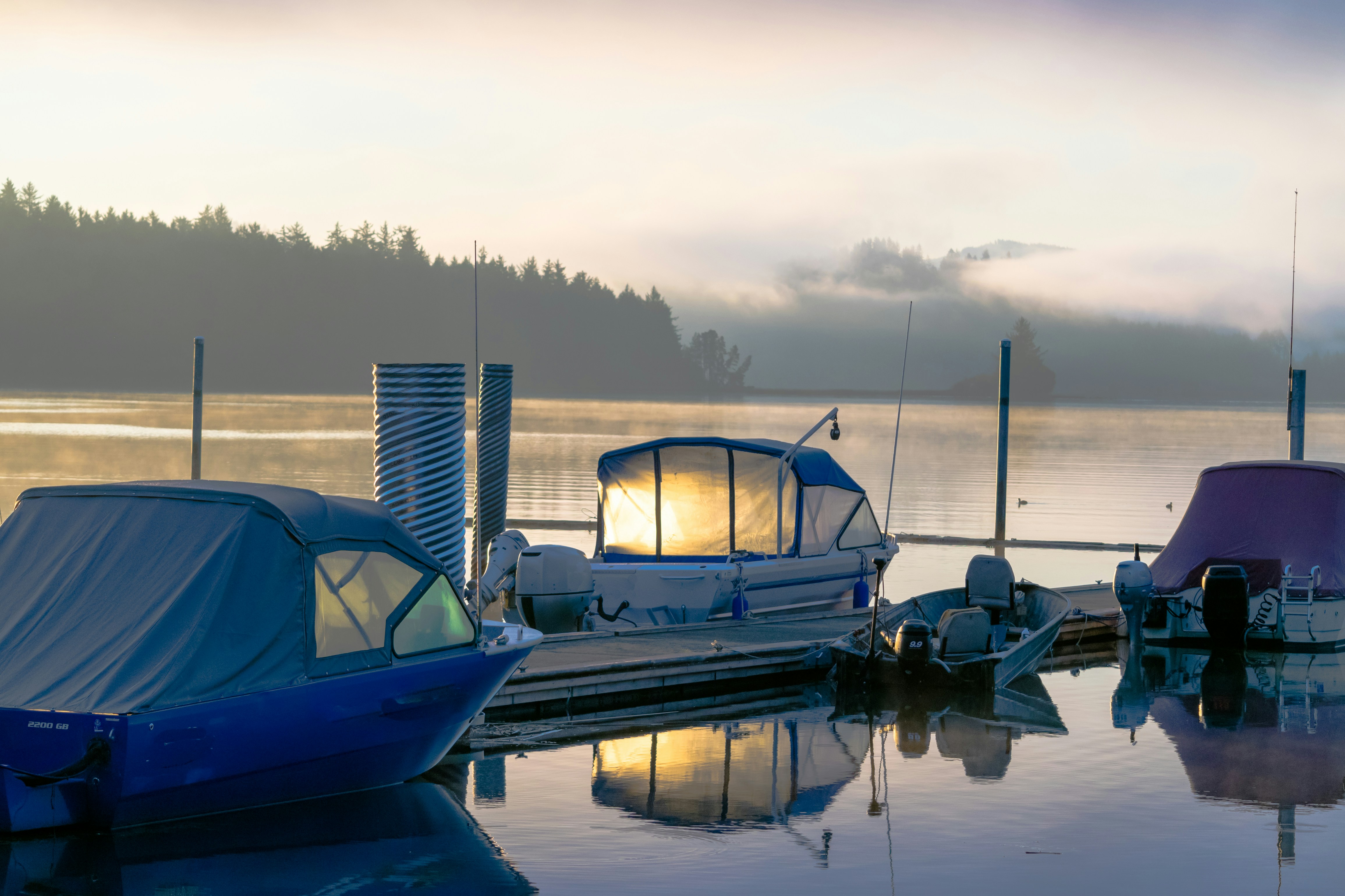 A group of boats that are sitting in the water