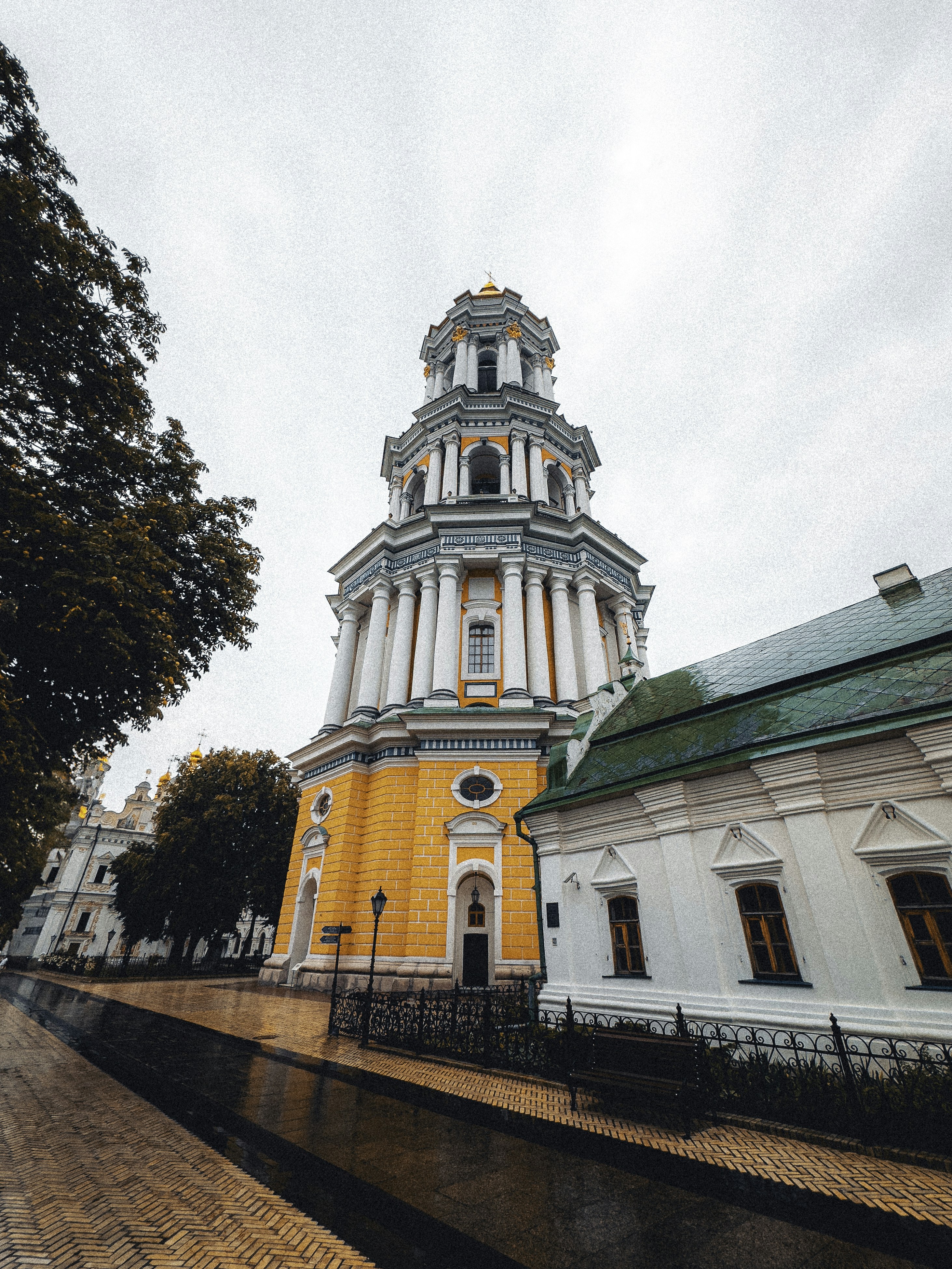 A tall white building with a green roof photo – Free Church Image on ...