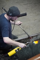 A man is working on a piece of metal
