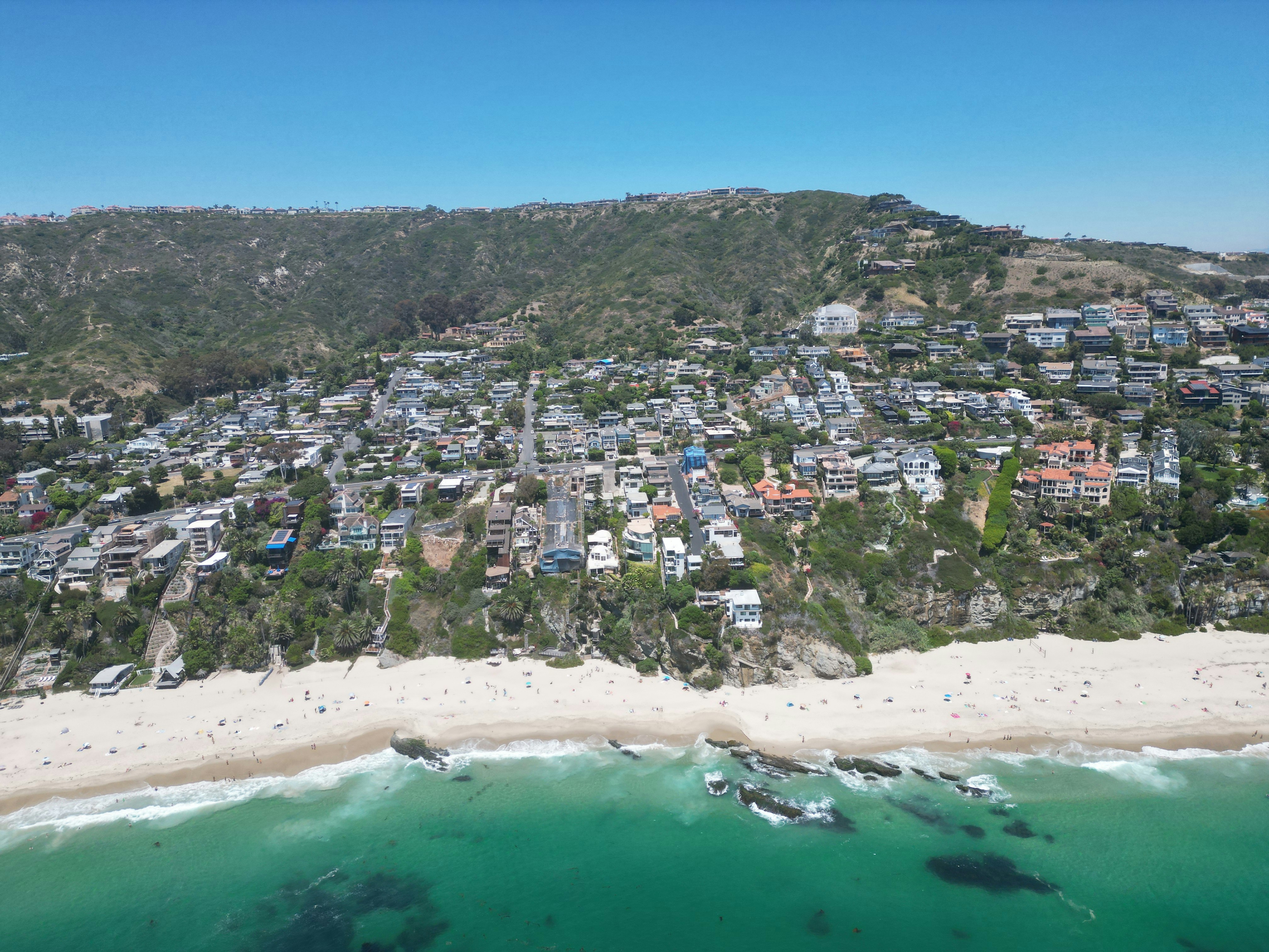 An aerial view of a beach and a cityby Logan Voss