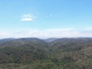 An aerial view of a mountain range with a river running through it
