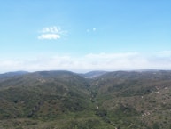 An aerial view of a mountain range with a river running through it