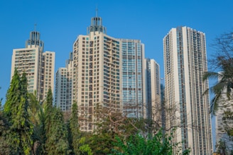 A group of tall buildings sitting next to each other