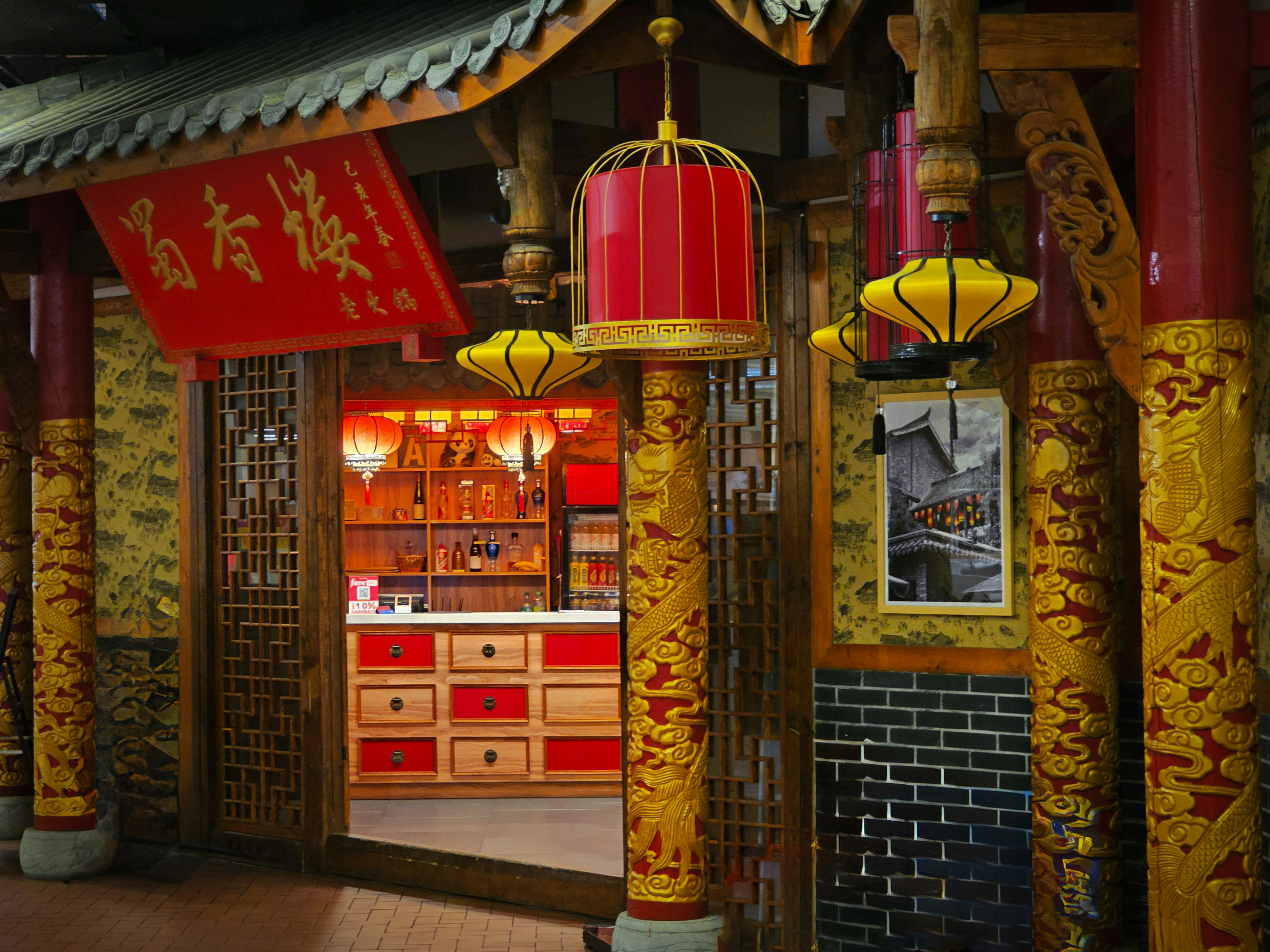 A traditional Chinese teahouse setting with wooden tables and porcelain tea sets - dim sum