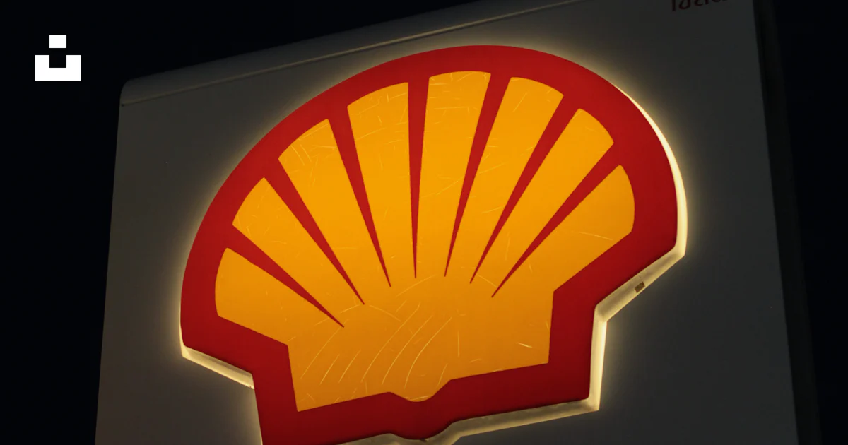 A shell gas station sign lit up at night photo – Free Phuket Image on ...
