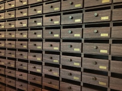 A wall full of many drawers in a room