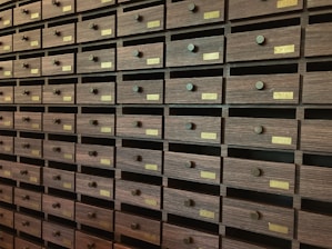 A wall full of many drawers in a room