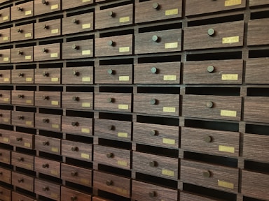 A wall full of many drawers in a room