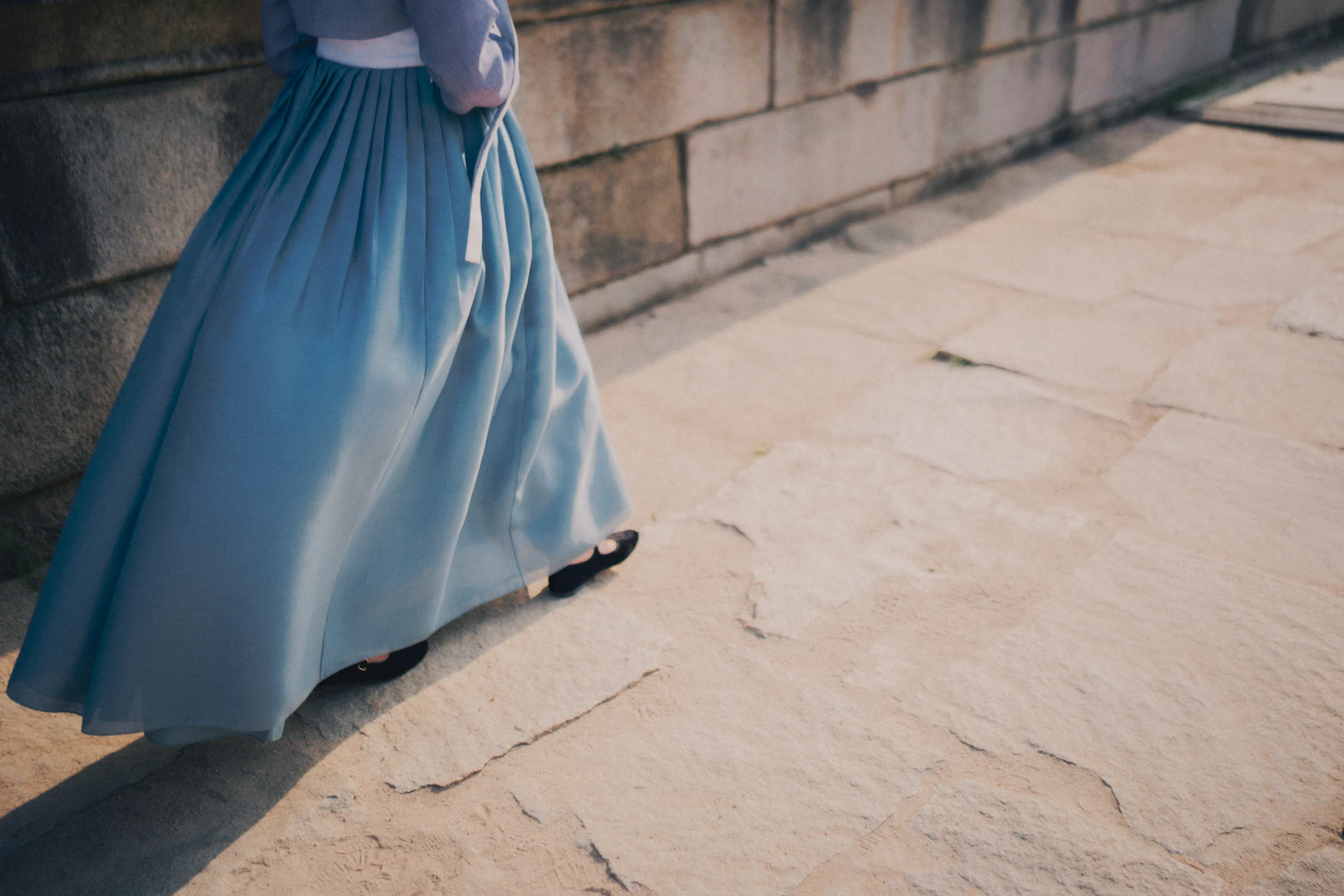 An elegant woman in a floor-length maxi skirt