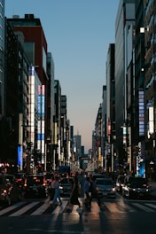 A city street filled with lots of tall buildings