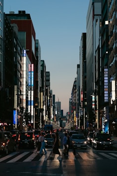 A city street filled with lots of tall buildings