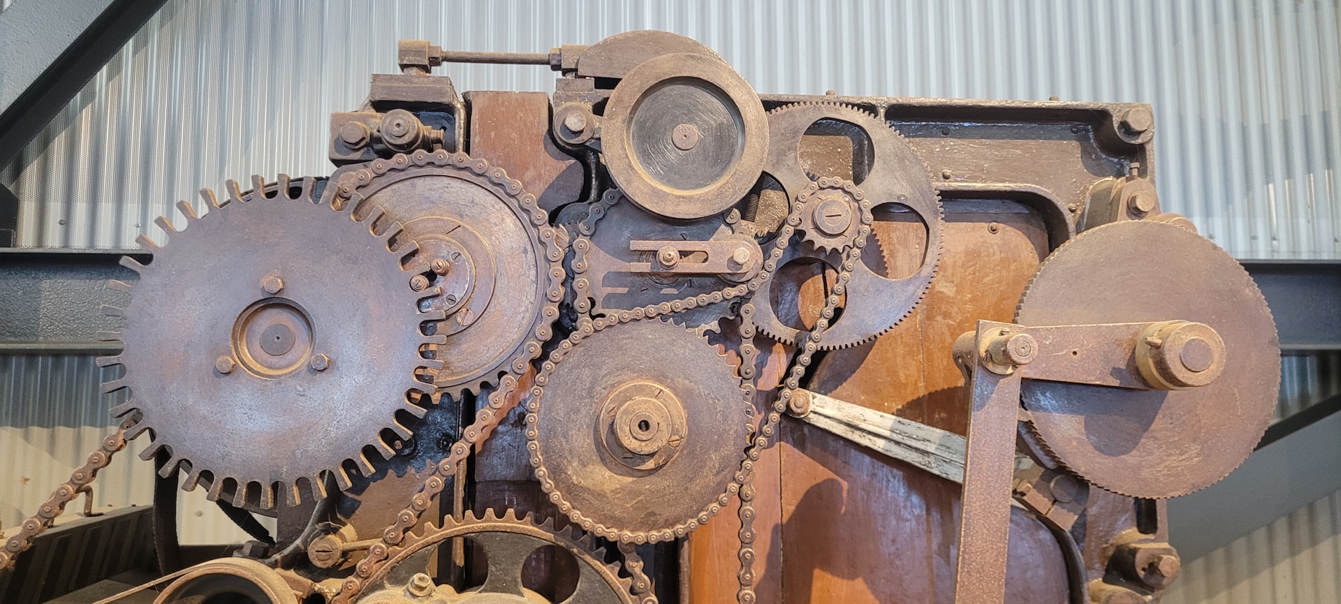 An old machine is sitting in a warehouse