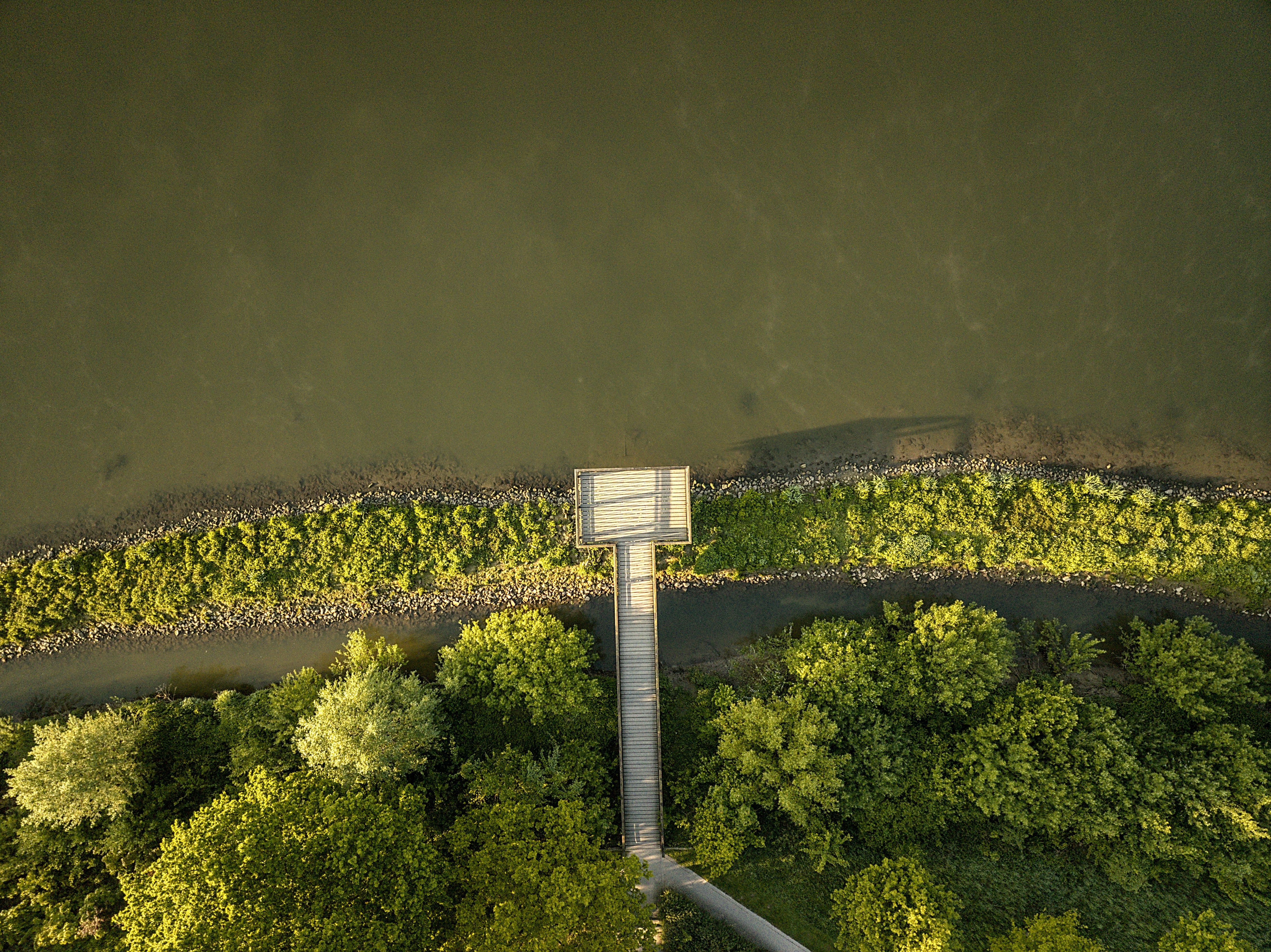 A bird's eye view of a river and a road
