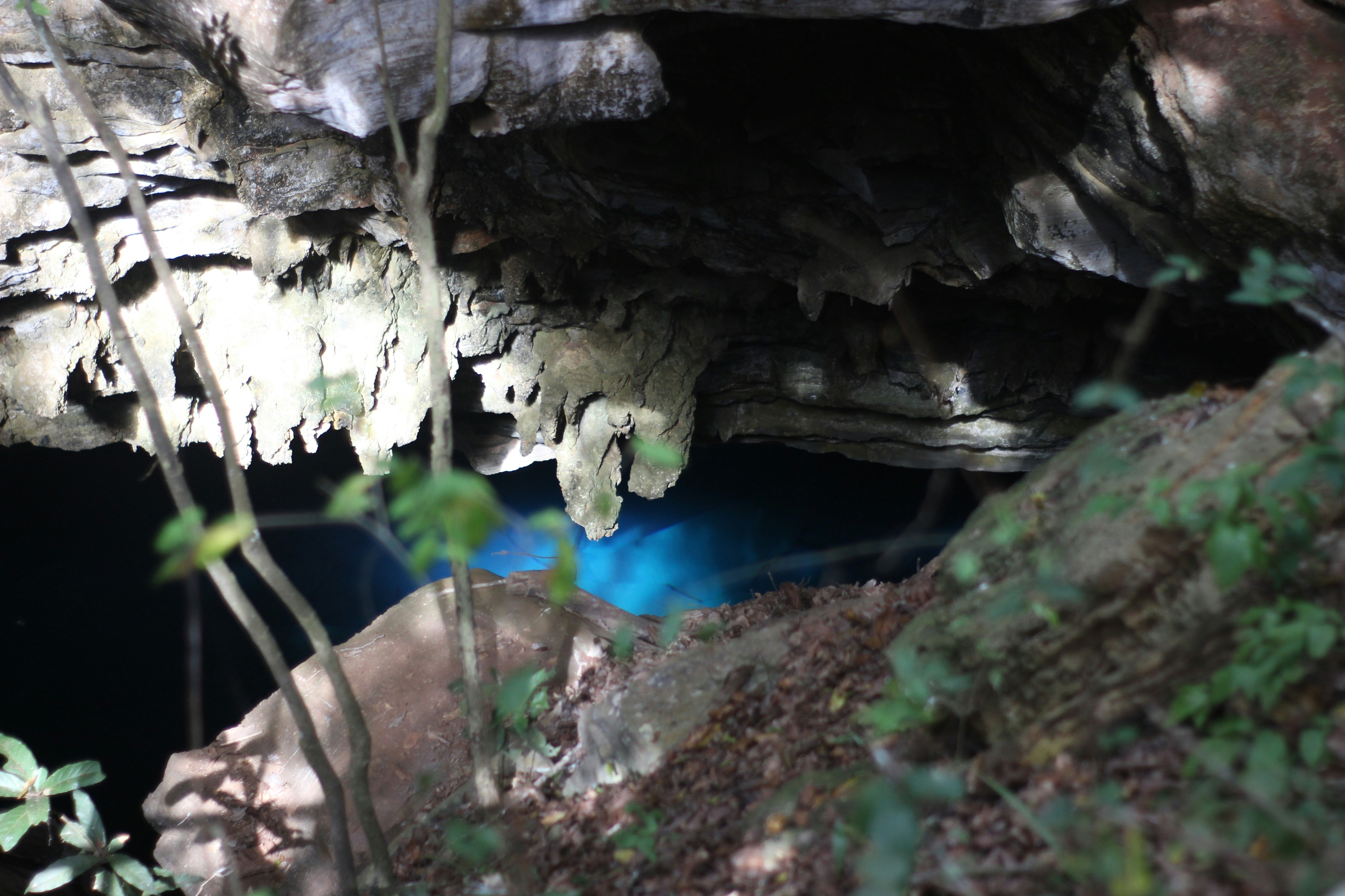A cave with a blue ball in the middle of it