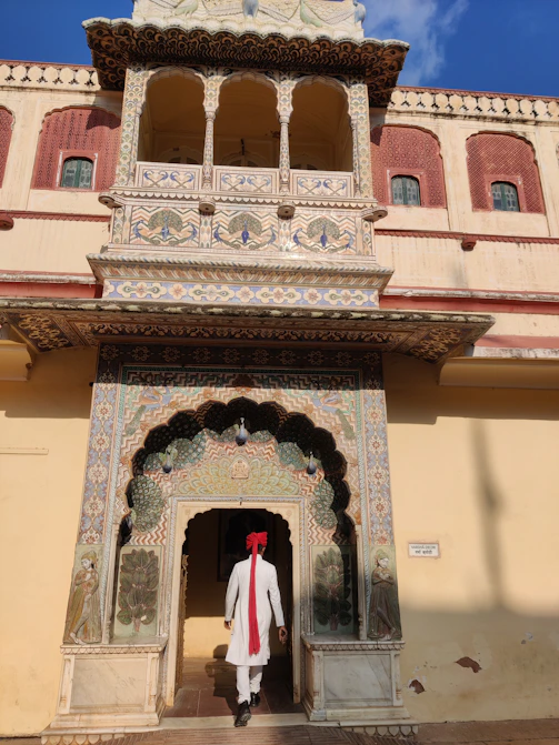 A man standing in front of a tall building