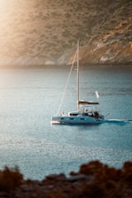 A sailboat in the middle of a body of water