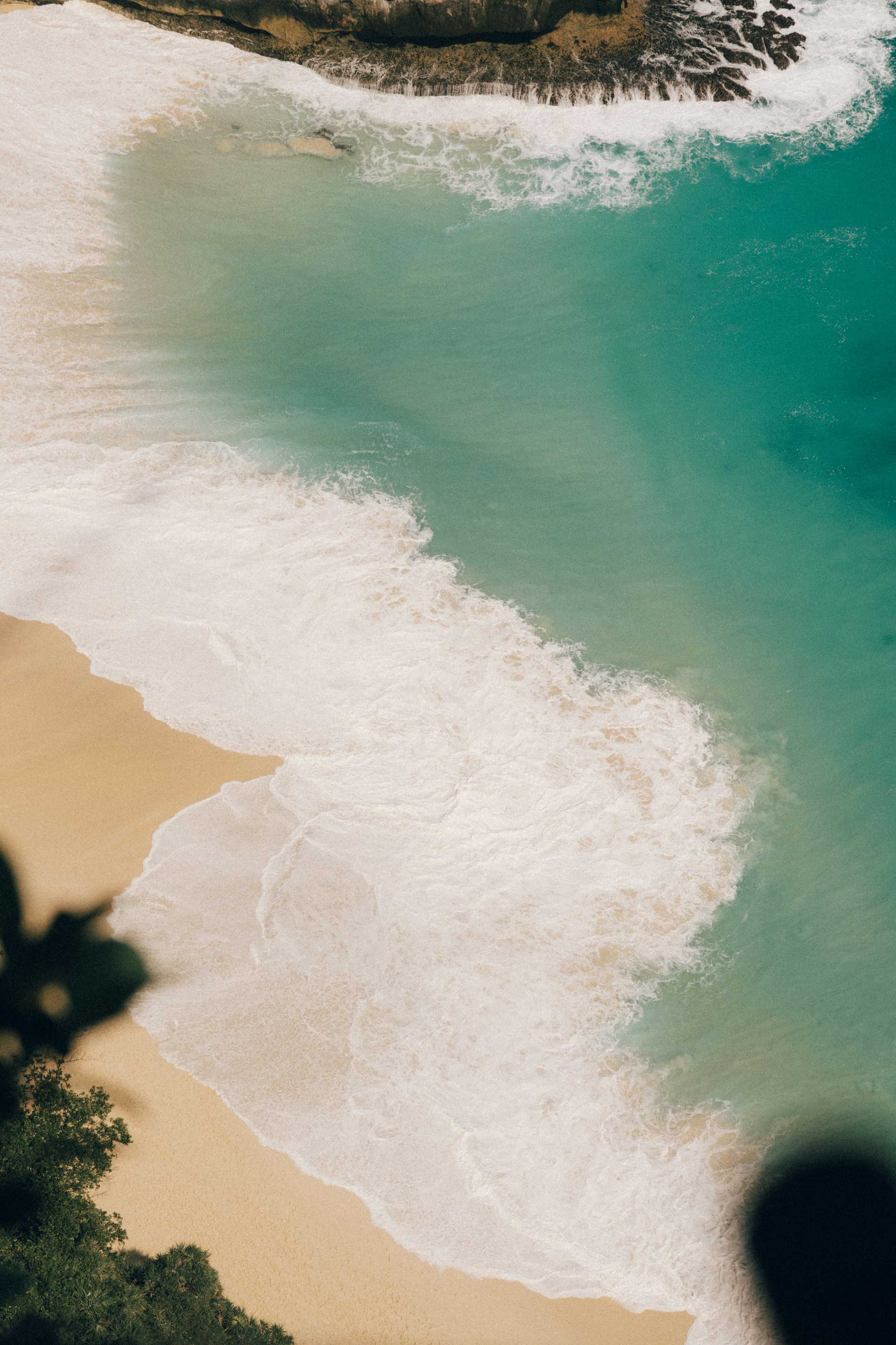 An aerial view of a beach and a body of water