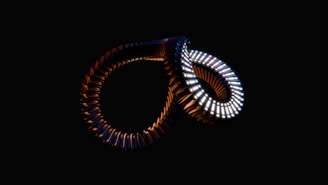 A close up of a pair of rings in the dark