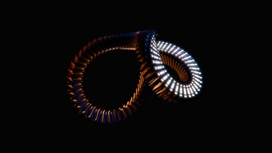 A close up of a pair of rings in the dark