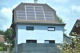A house with a solar panel on the roof
