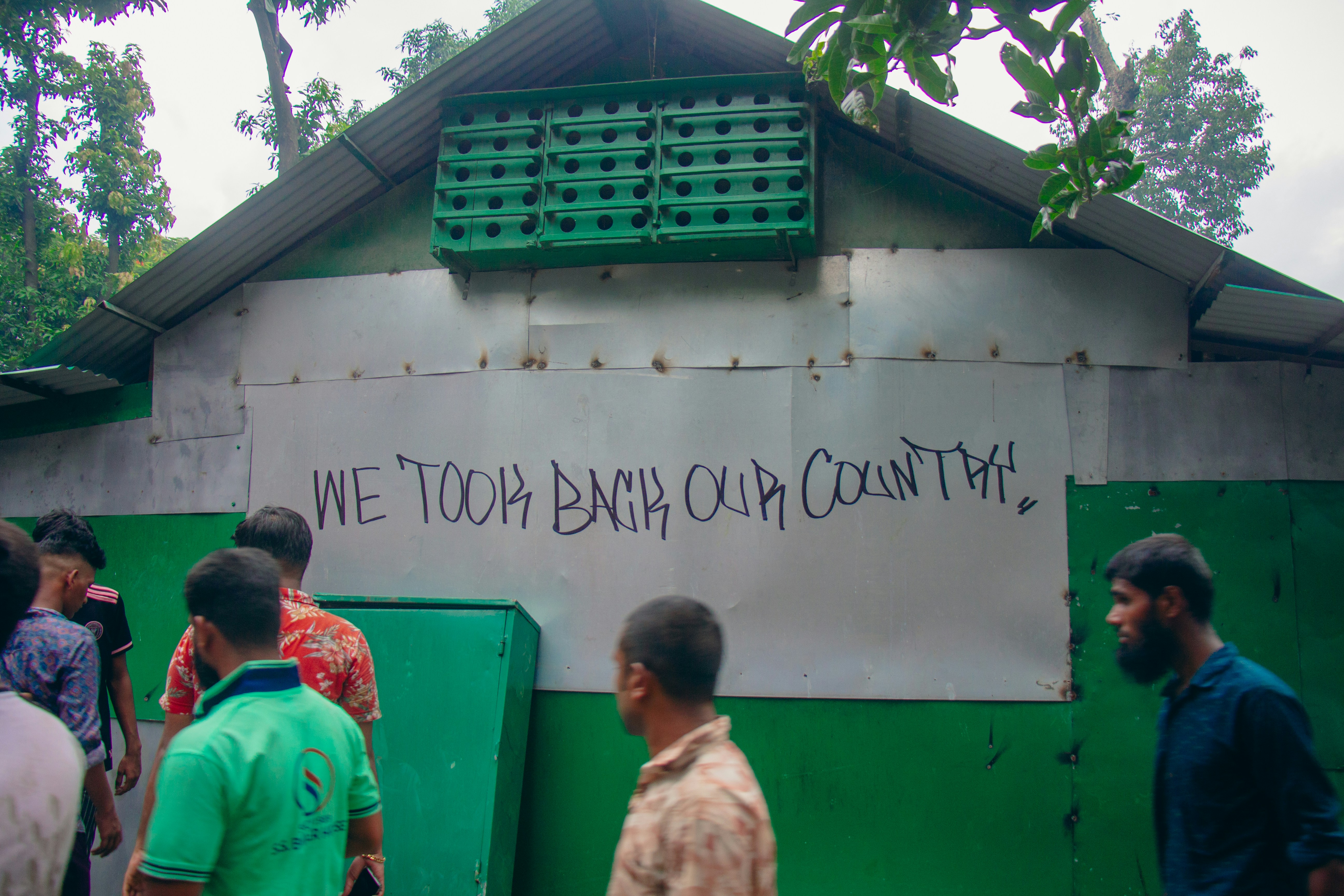 A group of people standing in front of a building