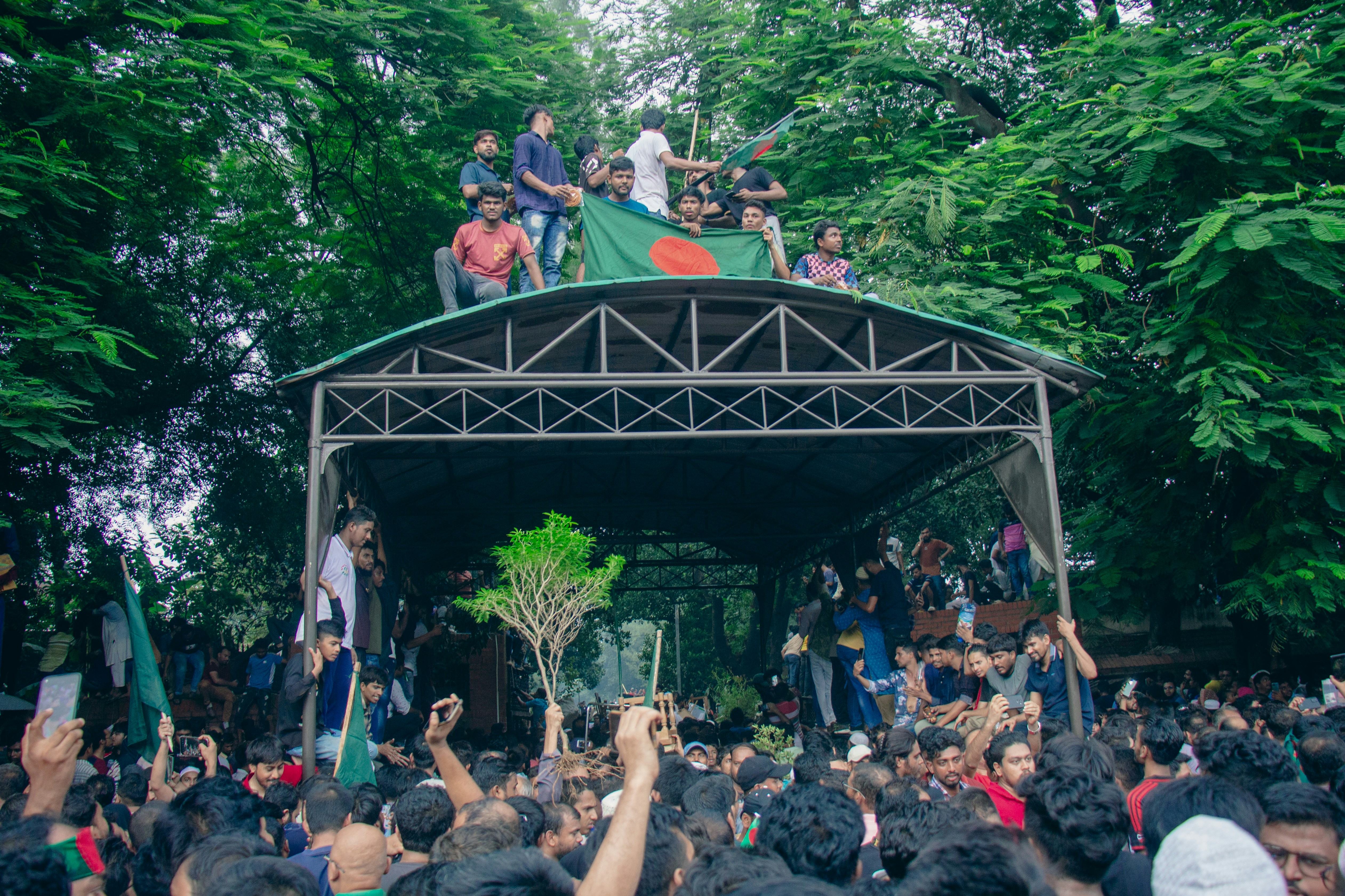 A crowd of people standing around a stage