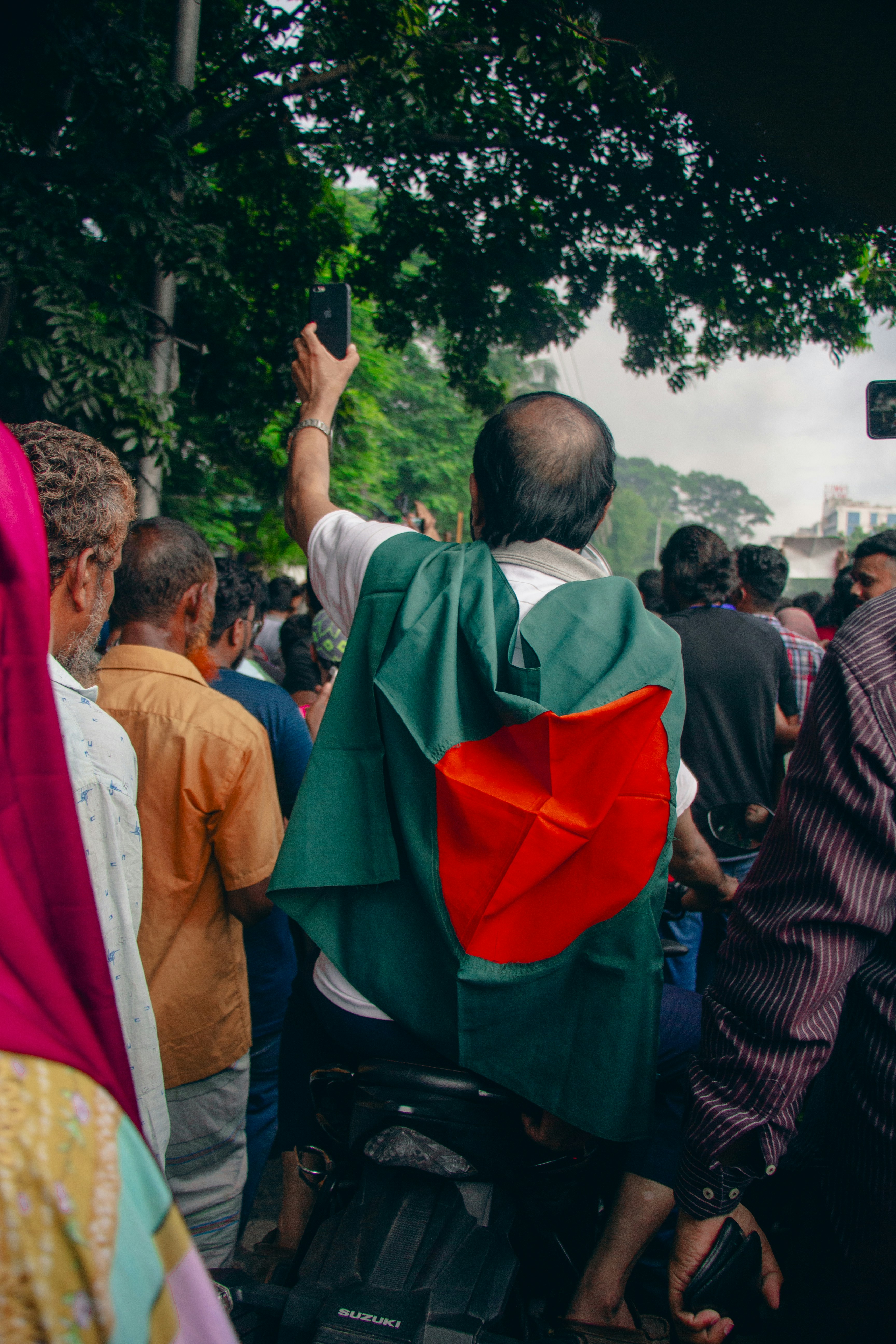 A group of people standing around each other