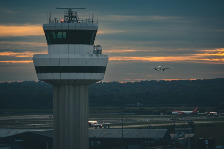 An air traffic control room with radar screens showing aircraft positions