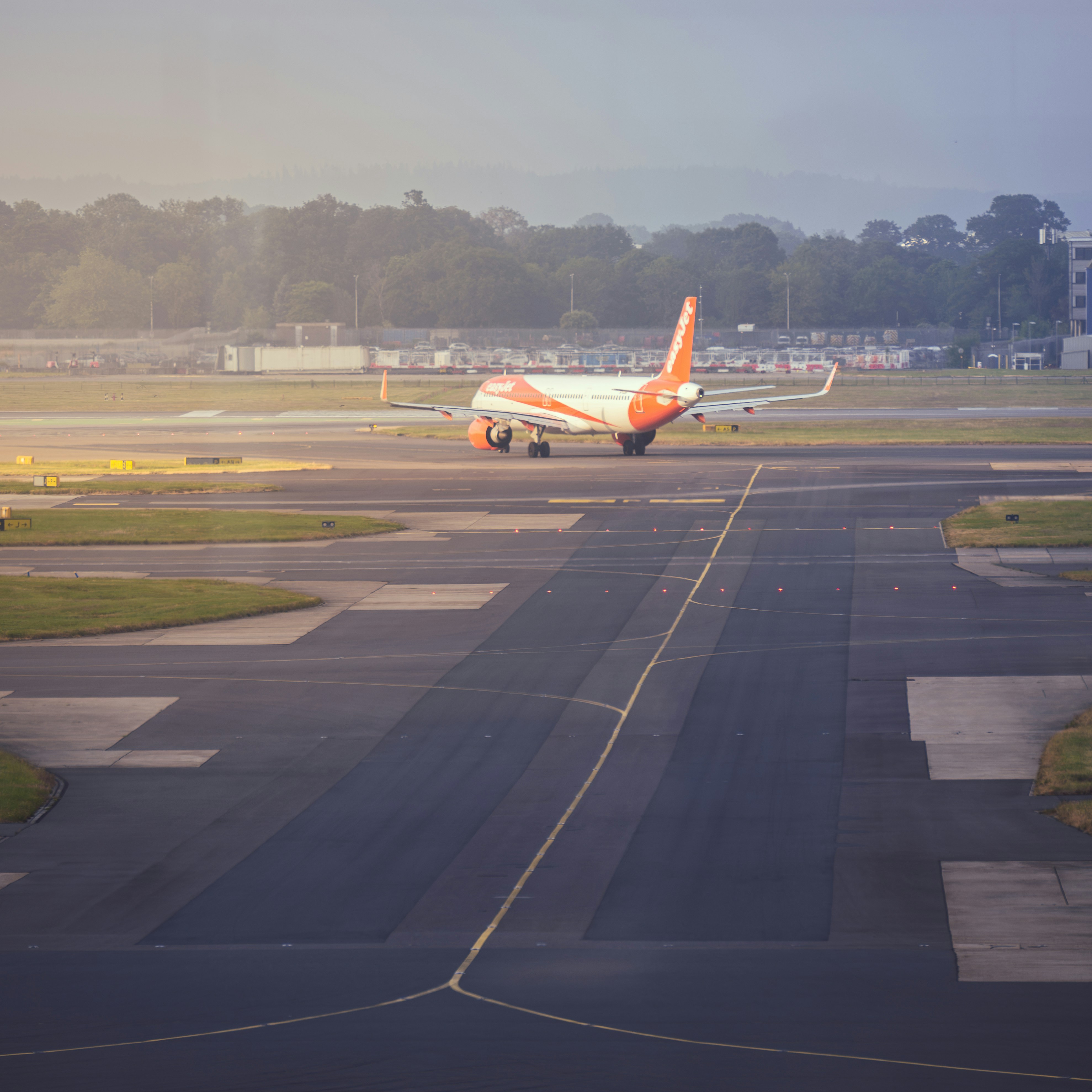 An airplane is on the runway of an airport