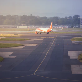 An airplane is on the runway of an airport
