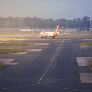 An airplane is on the runway of an airport