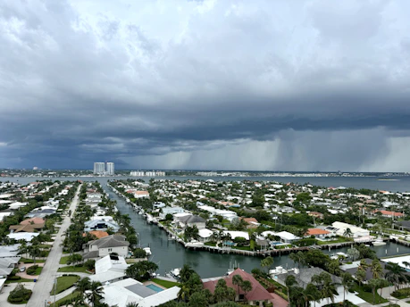 An aerial view of a city in Florida during a rain storm