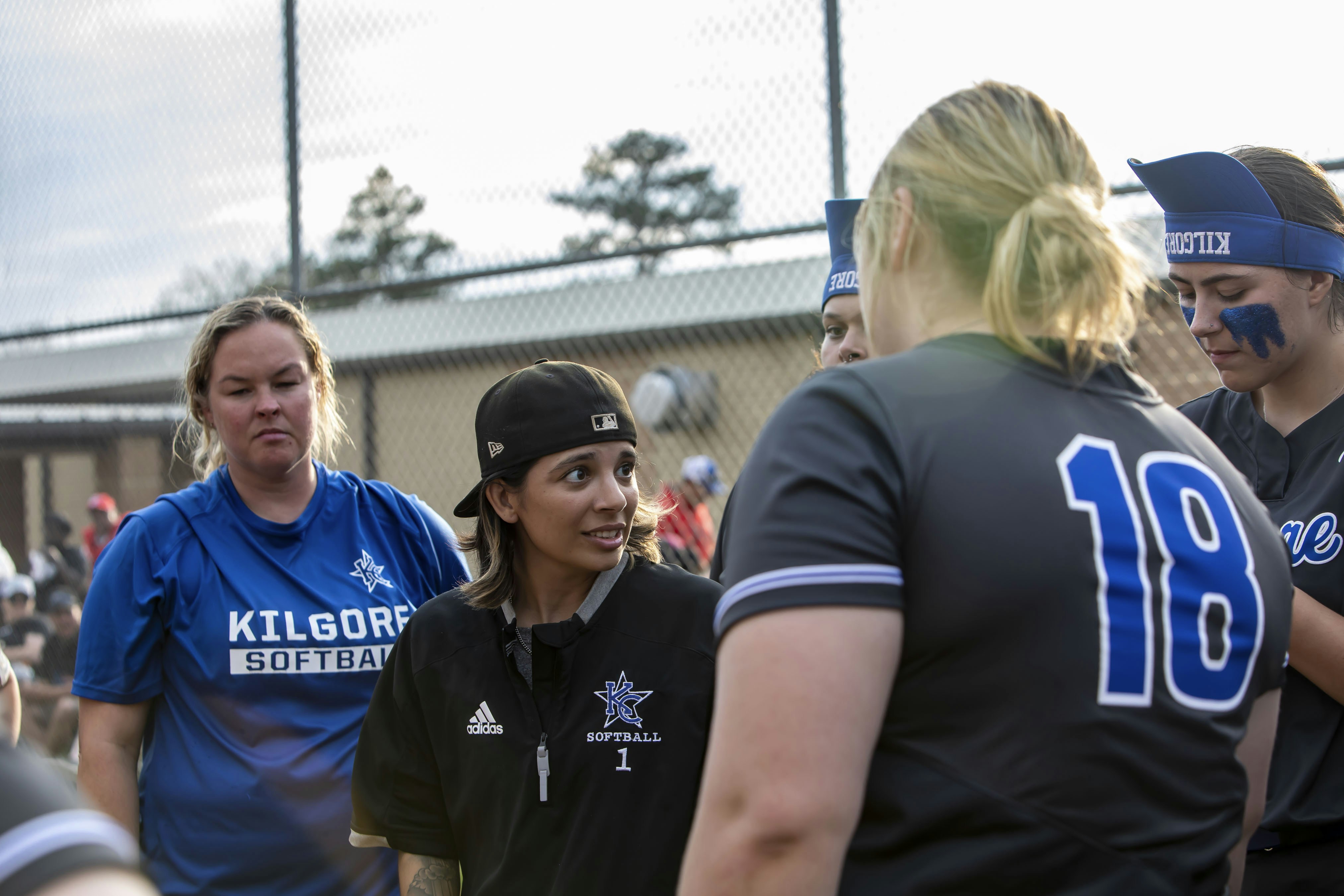 A group of people standing around each other