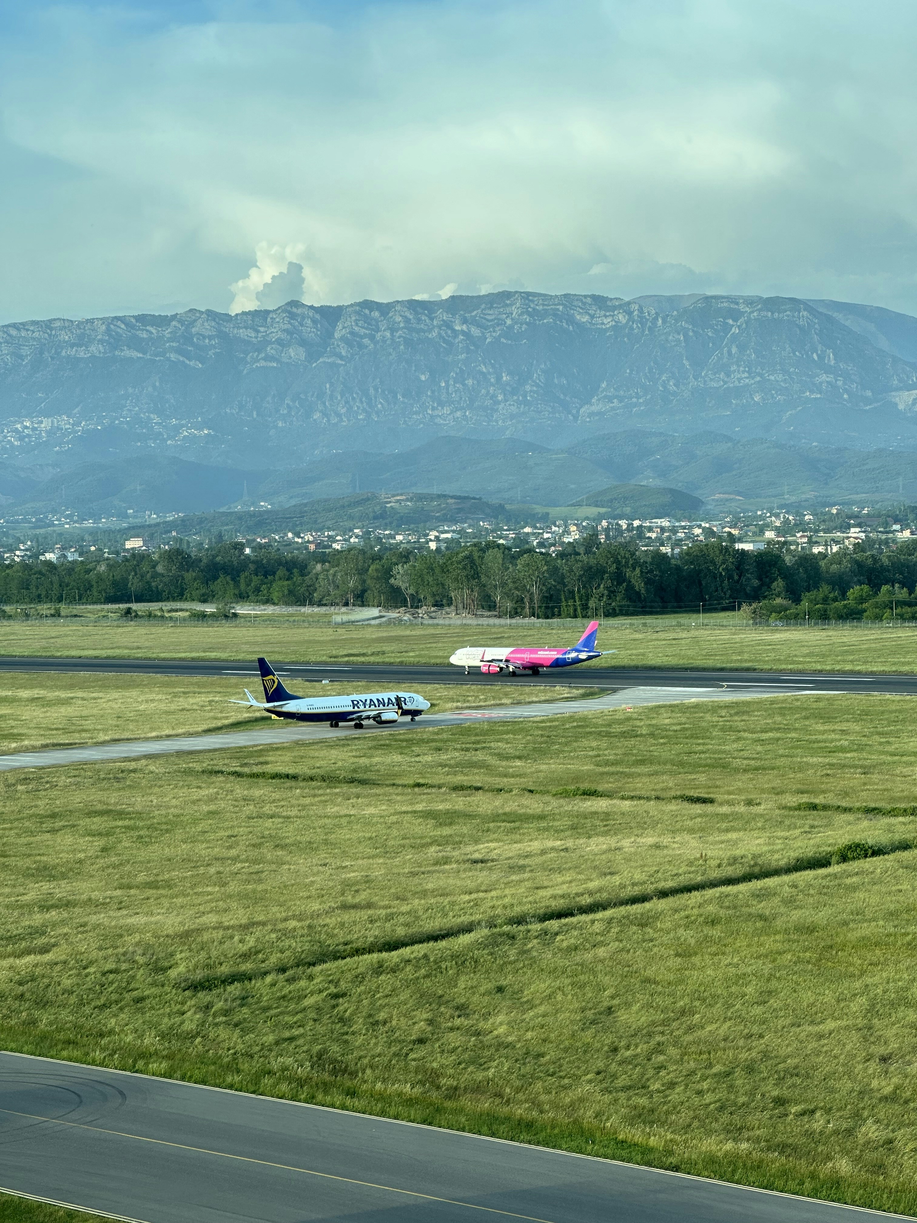 A plane is on the runway of an airport