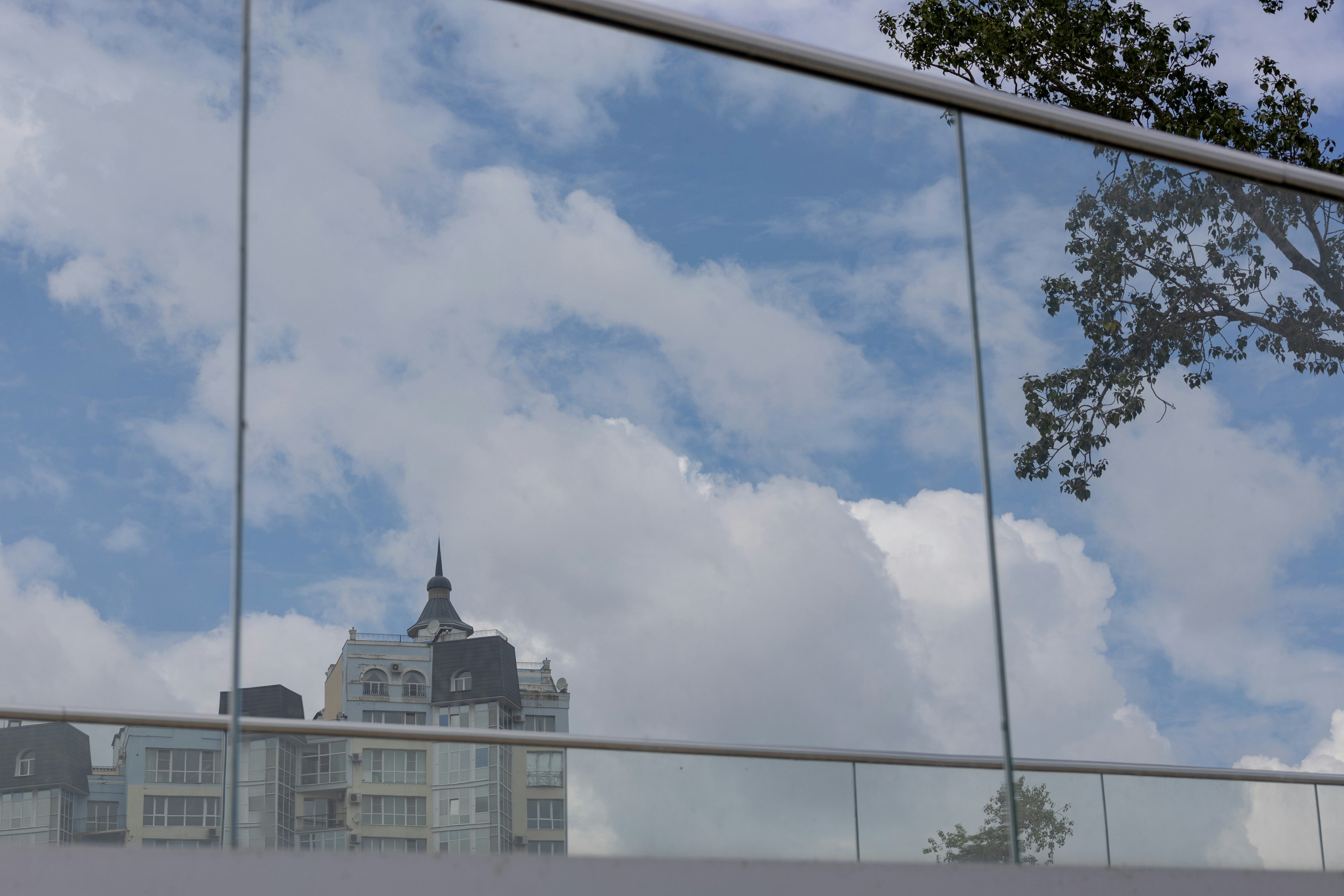A reflection of a building in a window