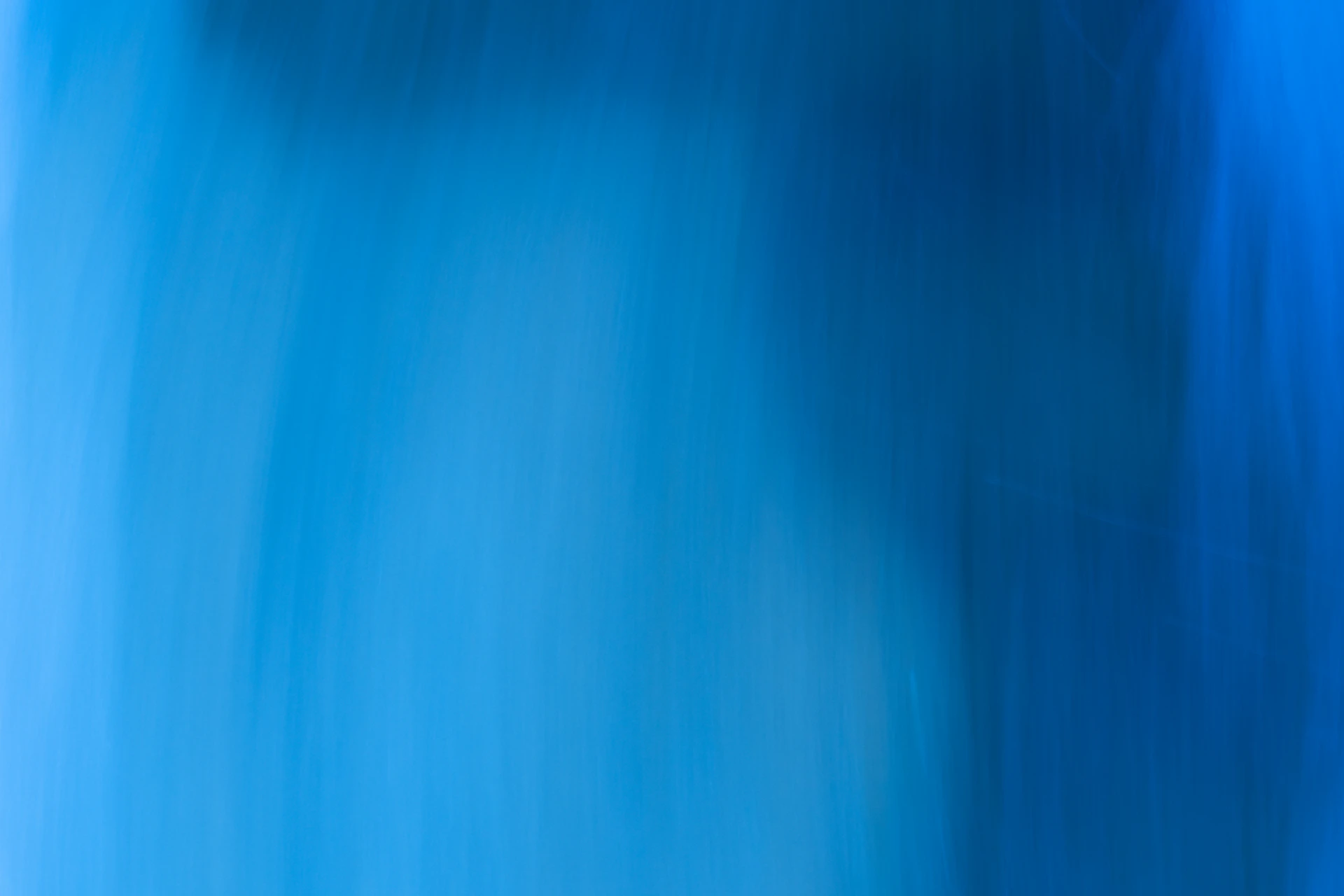 A blurry image of a blue background