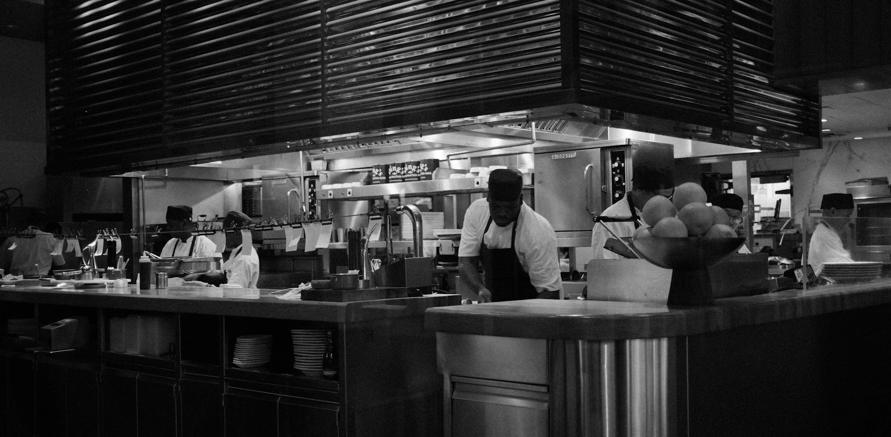 A chef preparing food in a restaurant kitchen