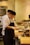 A man standing in a kitchen preparing food