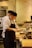 A man standing in a kitchen preparing food
