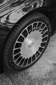A black and white photo of a car tire