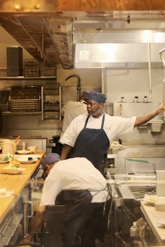 A group of people in a kitchen preparing food