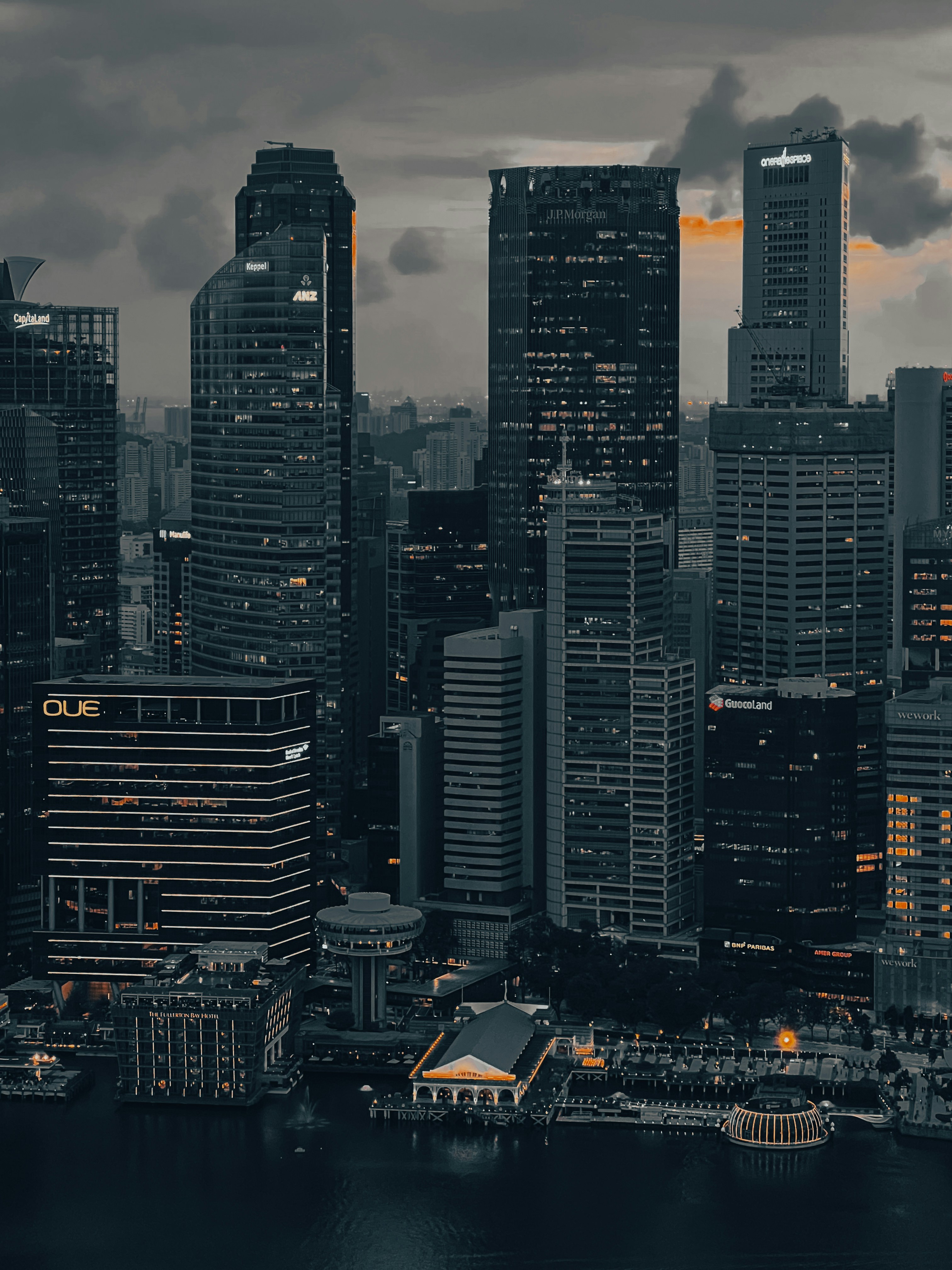 A view of a city at night from the water