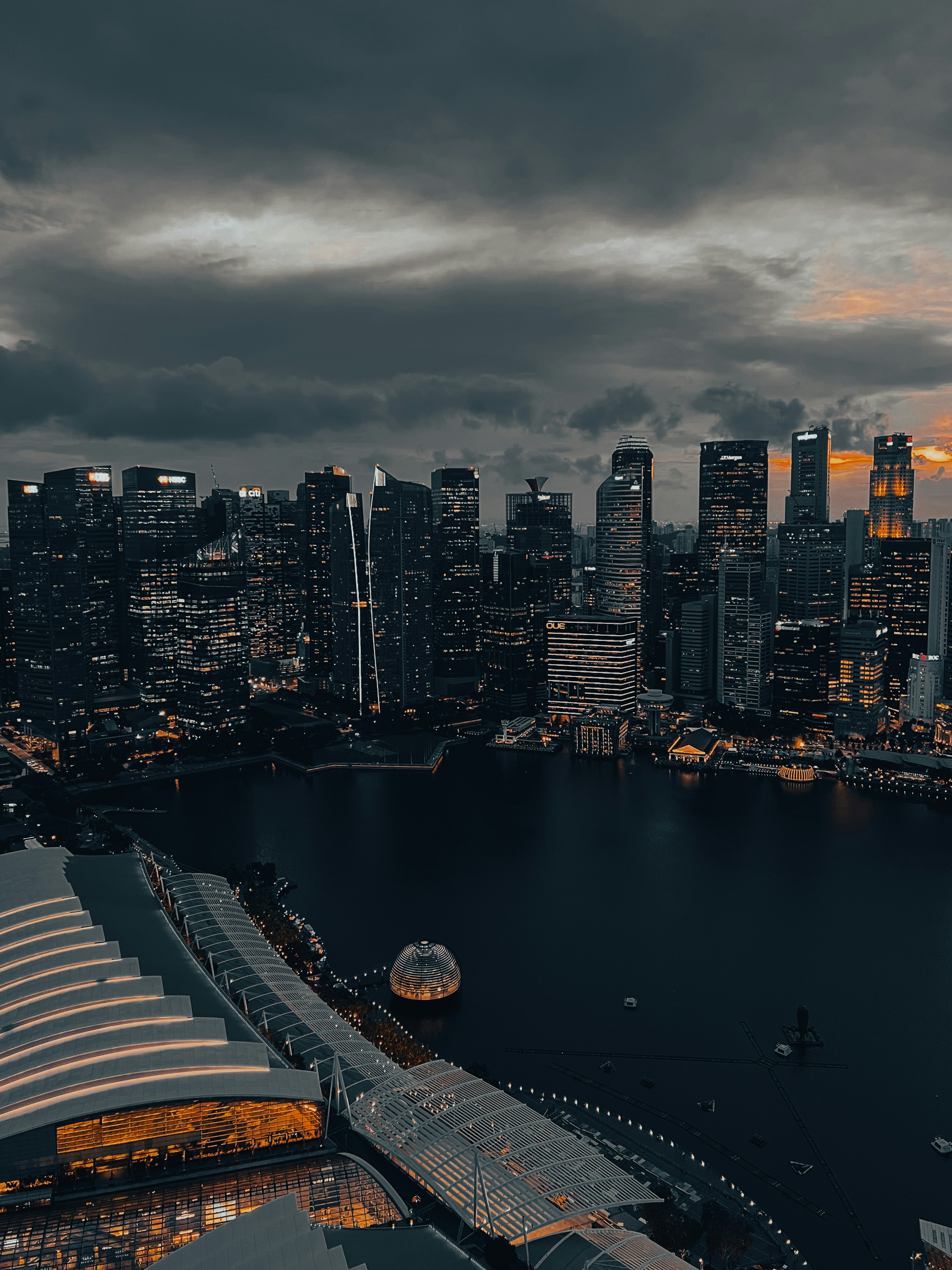 A view of a city at night from the top of a building