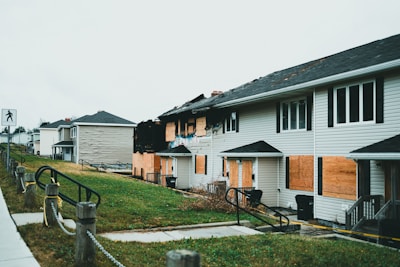 A row of houses with boarded up windows