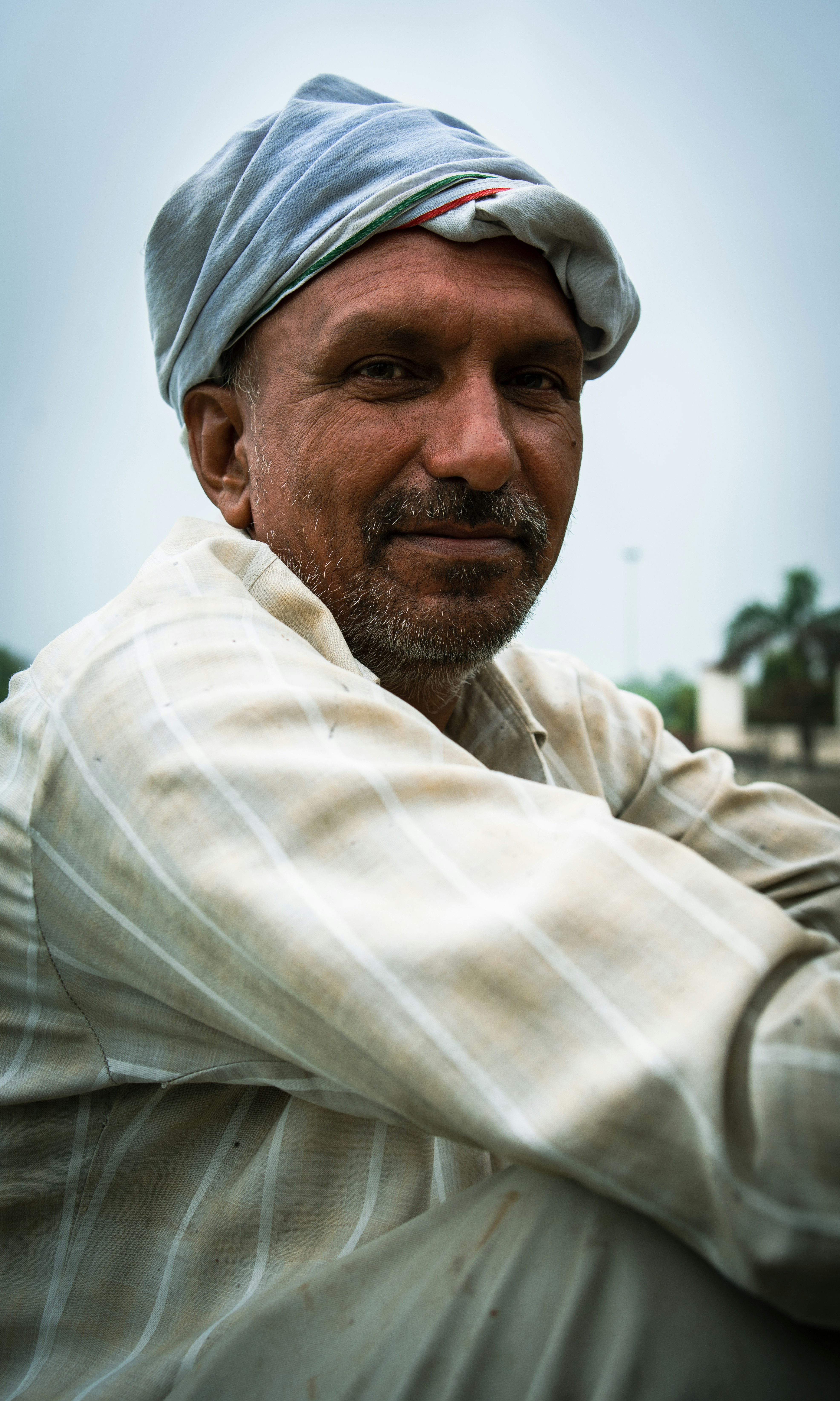 A man in a turban poses for a picture