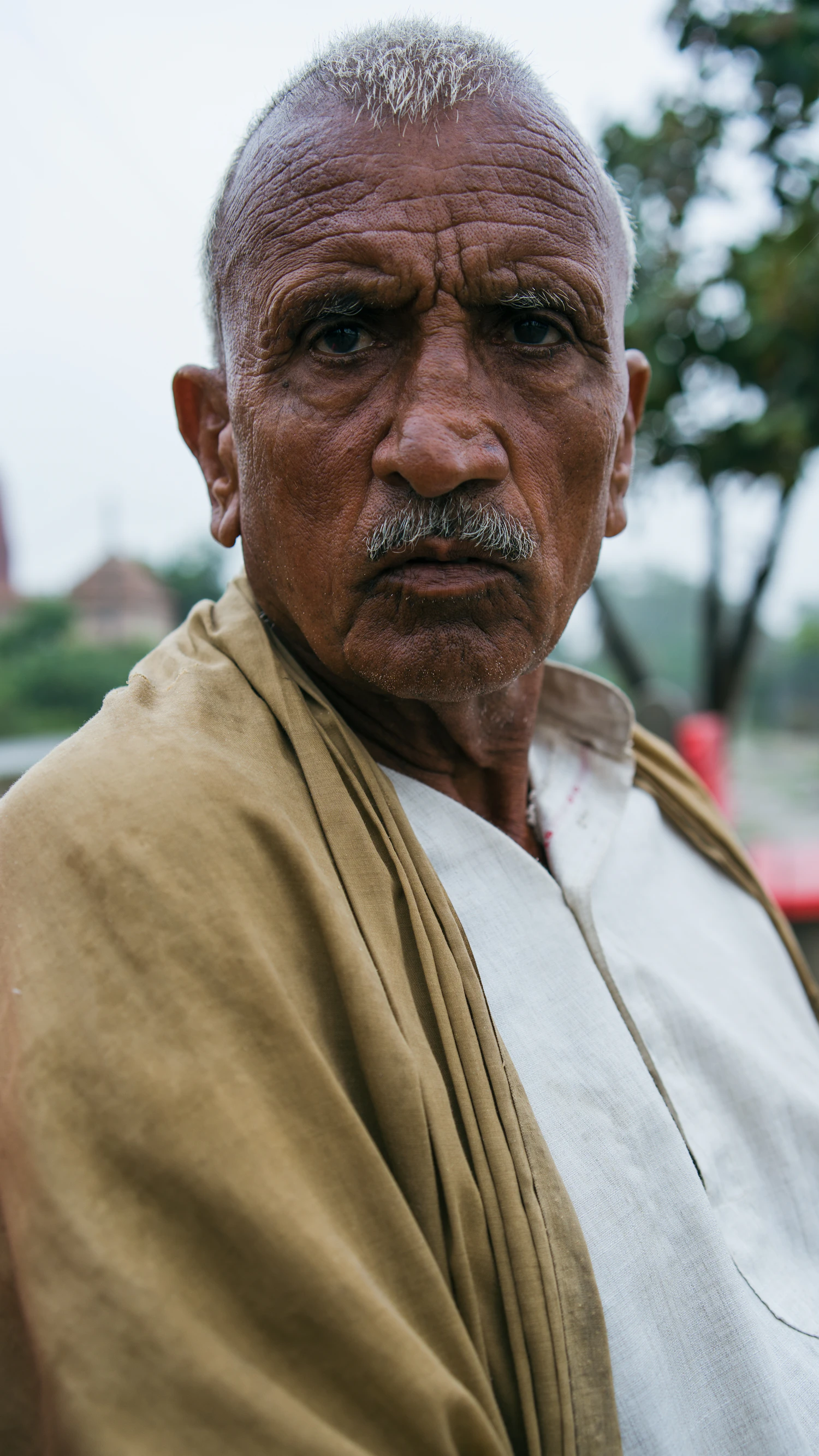 Prem Chaudhari photographed outdoors in flat afternoon light